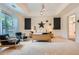 Spacious bedroom with tray ceilings, accent wall, sitting area and plenty of natural light at 4829 Moon Rd, Powder Springs, GA 30127