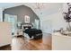 Bedroom featuring dark accent wall, wood floors, and ensuite bath at 4829 Moon Rd, Powder Springs, GA 30127