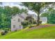 Charming brick home featuring lush landscaping and a well-manicured lawn on a spacious lot at 4829 Moon Rd, Powder Springs, GA 30127