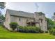 Back of house featuring a brick exterior, upper balcony, and well-maintained lawn at 4829 Moon Rd, Powder Springs, GA 30127
