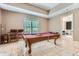 Finished game room featuring a pool table, comfortable seating and outdoor view at 4829 Moon Rd, Powder Springs, GA 30127