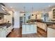 Kitchen featuring stainless steel appliances, a center island, and hardwood floors at 4829 Moon Rd, Powder Springs, GA 30127