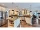 Bright kitchen with stainless steel appliances, granite countertops, and a spacious island with bar seating at 4829 Moon Rd, Powder Springs, GA 30127