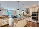 Kitchen featuring stainless steel appliances, a center island, and hardwood floors at 4829 Moon Rd, Powder Springs, GA 30127