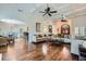 Open-concept living area featuring hardwood floors, coffered ceilings, and an arched doorway to dining at 4829 Moon Rd, Powder Springs, GA 30127