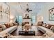 Elegant living room featuring coffered ceilings, hardwood floors, and a cozy fireplace at 4829 Moon Rd, Powder Springs, GA 30127