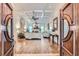 Elegant living room with coffered ceilings, hardwood floors, and a fireplace, offering a luxurious space at 4829 Moon Rd, Powder Springs, GA 30127