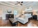 Bright main bedroom featuring tray ceilings, hardwood floors, and ample closet space at 4829 Moon Rd, Powder Springs, GA 30127