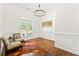 Bright office with wainscoting, hardwood floors, and a modern chandelier at 4829 Moon Rd, Powder Springs, GA 30127