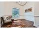 Bright office with wainscoting, hardwood floors, and a modern chandelier at 4829 Moon Rd, Powder Springs, GA 30127