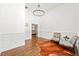 Bright office with wainscoting, hardwood floors, and a modern chandelier at 4829 Moon Rd, Powder Springs, GA 30127