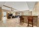 Spacious recreation room with wet bar, ceiling fans and comfortable seating at 4829 Moon Rd, Powder Springs, GA 30127