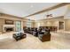 Large recreation room with multiple ceiling fans, theater seating, fireplace, and bar at 4829 Moon Rd, Powder Springs, GA 30127