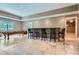 Large recreation room with a pool table, bar, window and access to an adjacent room at 4829 Moon Rd, Powder Springs, GA 30127
