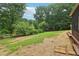 Picturesque backyard with mature trees, providing a serene and private outdoor space for relaxation and recreation at 9744 Spyglass Dr, Villa Rica, GA 30180