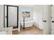 Modern bathroom features a soaking tub, sleek fixtures, a black-framed shower, and a window at 9744 Spyglass Dr, Villa Rica, GA 30180