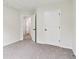 The bedroom is carpeted and has neutral color paint at 9744 Spyglass Dr, Villa Rica, GA 30180