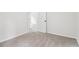 Minimalist bedroom featuring fresh paint, neutral carpet, and a white door at 9744 Spyglass Dr, Villa Rica, GA 30180