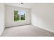 Bedroom with a large window that offers view of exterior and letting in abundant natural light at 9744 Spyglass Dr, Villa Rica, GA 30180