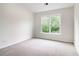 Carpeted bedroom with natural light from the window at 9744 Spyglass Dr, Villa Rica, GA 30180