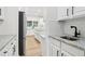 Kitchen features white cabinets, granite countertops, and stainless steel appliances at 9744 Spyglass Dr, Villa Rica, GA 30180