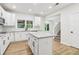 Spacious kitchen with white cabinets, granite countertops, and a center island at 9744 Spyglass Dr, Villa Rica, GA 30180