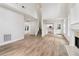 Spacious living room boasting hardwood floors, a cozy fireplace, and lots of natural light at 9744 Spyglass Dr, Villa Rica, GA 30180