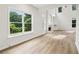 Bright living room featuring vaulted ceilings, large windows, and a fireplace at 9744 Spyglass Dr, Villa Rica, GA 30180