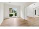 Bright living room featuring hardwood floors, crown molding, and natural light from large windows at 9744 Spyglass Dr, Villa Rica, GA 30180