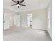 Spacious main bedroom features ceiling fan, and doors to bathroom and walk-in closet at 9744 Spyglass Dr, Villa Rica, GA 30180