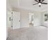 Main bedroom features ceiling fan, light gray carpet and doors to en-suite bath and walk-in closet at 9744 Spyglass Dr, Villa Rica, GA 30180