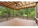 Outdoor patio providing beautiful views with a wood ceiling with a fan, screened with wood lattices at 9744 Spyglass Dr, Villa Rica, GA 30180