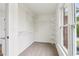 Spacious walk-in closet with ample shelving and natural light from a large window at 9744 Spyglass Dr, Villa Rica, GA 30180