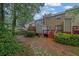 The backyard of the house has a patio, stairs and green plants around it at 1066 Wedgewood Ln, Tucker, GA 30084
