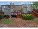 The backyard of the house has a patio, stairs and green plants around it at 1066 Wedgewood Ln, Tucker, GA 30084