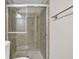 Shower with glass door and towel rack at 1066 Wedgewood Ln, Tucker, GA 30084