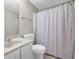 Bathroom featuring a shower with curtain, a sink with a marble countertop, and a toilet at 1066 Wedgewood Ln, Tucker, GA 30084