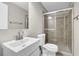 Neat bathroom featuring a white sink and stand-up shower with glass door at 1066 Wedgewood Ln, Tucker, GA 30084