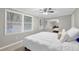 Light-filled bedroom featuring neutral walls, ceiling fan, and carpet at 1066 Wedgewood Ln, Tucker, GA 30084