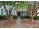 Charming townhome featuring well-maintained landscaping, inviting entryway, and classic architectural details at 1066 Wedgewood Ln, Tucker, GA 30084