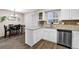 Bright kitchen view featuring granite countertops, breakfast bar, and white cabinets at 1066 Wedgewood Ln, Tucker, GA 30084