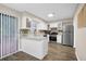 Modern kitchen featuring white cabinets, stainless steel appliances, and sliding glass doors at 1066 Wedgewood Ln, Tucker, GA 30084