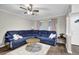 Well-lit living room featuring a large blue sectional and a cozy atmosphere at 1066 Wedgewood Ln, Tucker, GA 30084