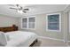 Bright bedroom with large windows, ceiling fan, and a dresser at 1066 Wedgewood Ln, Tucker, GA 30084