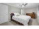 Spacious bedroom with ceiling fan, windows, and a dresser at 1066 Wedgewood Ln, Tucker, GA 30084