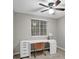 Cozy office with ample natural light, a ceiling fan, and a modern desk at 1066 Wedgewood Ln, Tucker, GA 30084