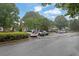 Large parking lot with multiple parked cars and green trees providing a quiet atmosphere at 1066 Wedgewood Ln, Tucker, GA 30084