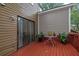 Inviting patio featuring a small table and well-maintained wood flooring at 1066 Wedgewood Ln, Tucker, GA 30084