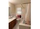 Bathroom featuring a tile shower, vanity with sink, and toilet at 2990 Piedmont Dr, Marietta, GA 30066