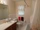Bathroom featuring a tile shower, vanity with sink, and toilet at 2990 Piedmont Dr, Marietta, GA 30066